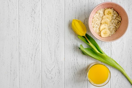 healthy breakfast with porridge on wooden background top view mockup.の写真素材