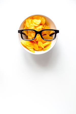 concept of watching movies with chips top view on white backgroundの写真素材