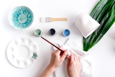 painted ceramic cup on white background top viewの写真素材