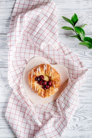 Breakfast concept with flowers on wooden background top viewの写真素材