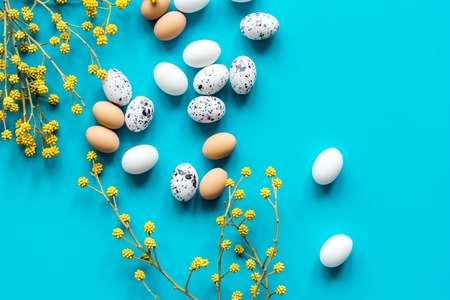 Bright easter set with eggs on blue background top view mock-up