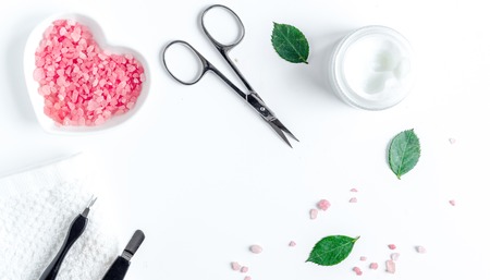 oil and cream for nail care in spa on white background top viewの写真素材