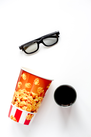 concept of watching movies with popcorn top view on white backgroundの写真素材