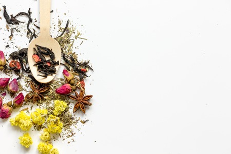 Virious kinds of herbs in wooden spoon on white table background top view mockupの写真素材