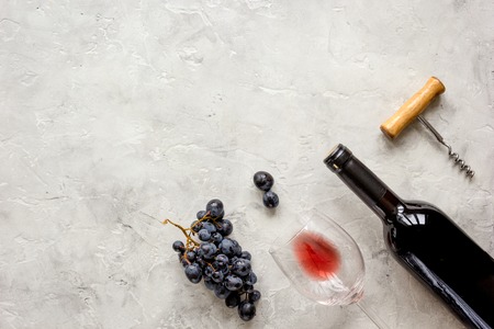 bottle of red wine with glass on texture background top view mock-upの写真素材
