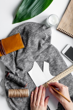 desktop designer clothes with tools top view mock upの写真素材