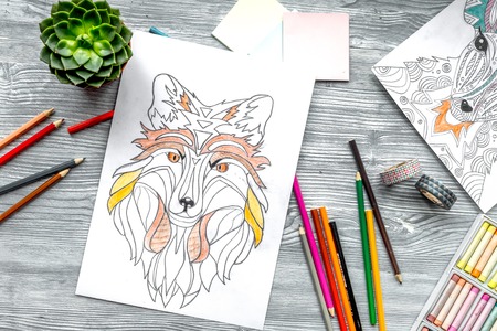 coloring picture for adults on wooden background top viewの写真素材