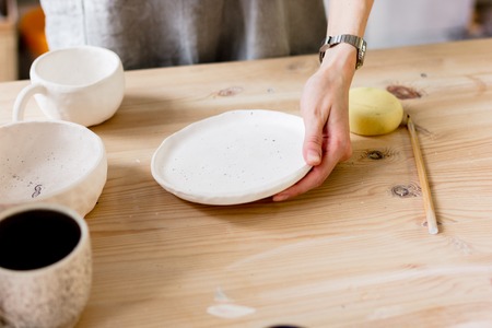 workshop production of ceramic tableware product paintingの写真素材