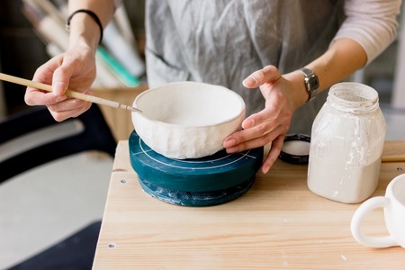 workshop production of ceramic tableware product paintingの写真素材