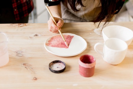 workshop production of ceramic tableware product paintingの写真素材