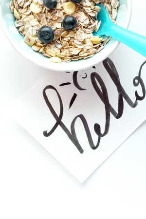 concept kid breakfast with muesli top view on white backgroundの写真素材