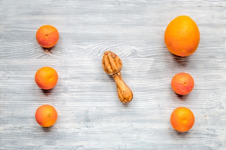 fresh oranges with mint on gray wooden table background top view mockupの写真素材