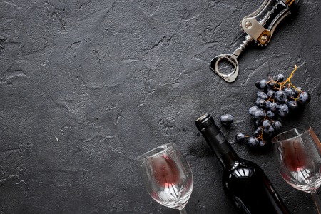 bottle of red wine with glasses on texture background top view mock-upの写真素材