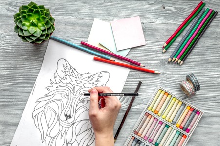 coloring picture for adults on wooden background top view