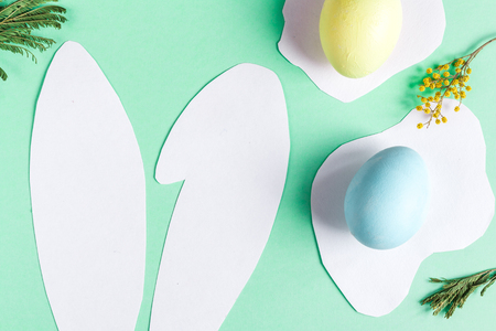 Easter concept on green background top view mockupの写真素材