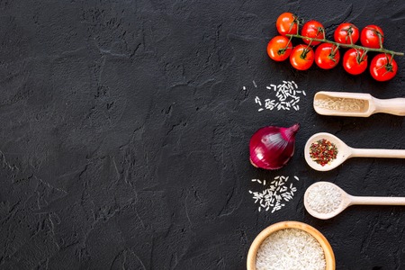 ingredients for paella on dark background top viewの写真素材