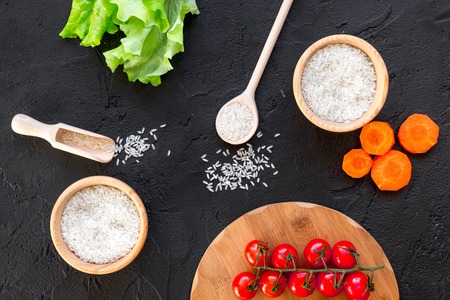 ingredients for paella on dark background top viewの写真素材