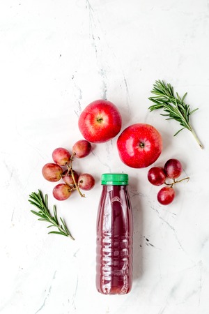 bottles of smoothie with fruits on white table top view mock-upの写真素材