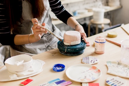 workshop production of ceramic tableware product paintingの写真素材