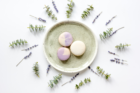 light breakfast with macaroons on spring pattern white background top viewの写真素材