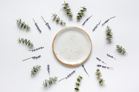 Trendy design with plate, eucalyptus and lavander top view mock upの写真素材