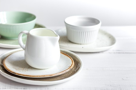 ceramic tableware with flowers on white tableの写真素材