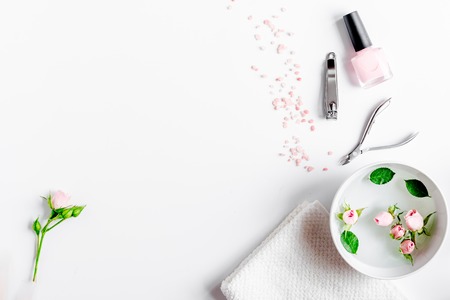 Salt and cream for nail care in spa on white background top viewの写真素材