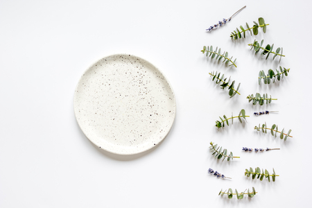 Trendy design with plate, eucalyptus and lavander top view mock upの写真素材