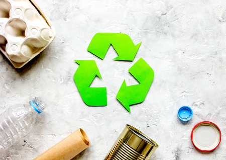 environment concept with recycling symbol on stone background top view mock-up