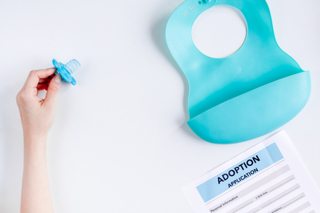 family concept with adoption application on desk top view mock upの写真素材