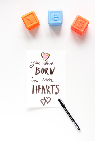 family concept with card on desk top view mock upの写真素材