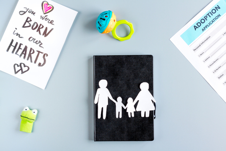 family concept with notebook and figures on desk top viewの写真素材