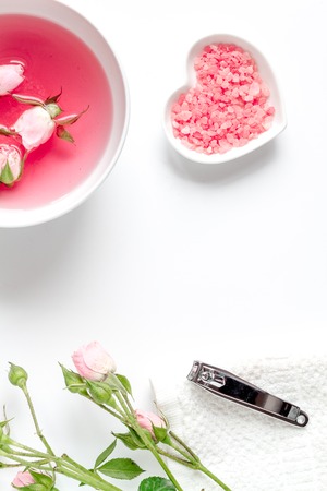 Salt and cream for nail care in spa on white background top viewの写真素材