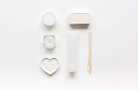 White set of cosmetics for spa on table background top view mockup