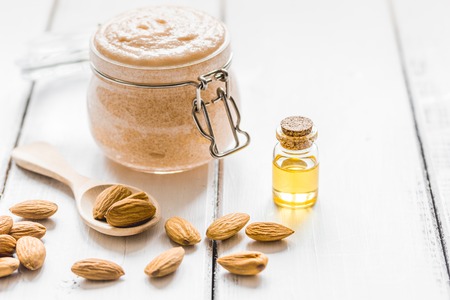 spa concept with almond oil in organic cosmetic set on white desk backgroundの写真素材