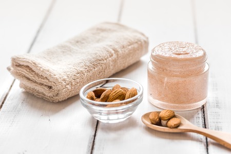 organic body scrub with almonds for body care concept on light table backgroundの写真素材