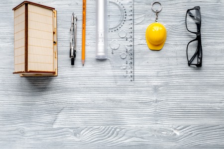 Architects workplace with tools on light wooden background top view mockupの写真素材