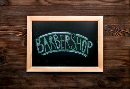 barbershop table in men cosmetic concept on wooden background top view mockupの写真素材