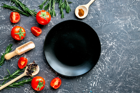 restaurant kitchen with tomato and rosemary on gray background top view mock-upの写真素材