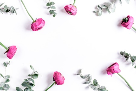floral concept with pink flowers on white background top view mock-upの写真素材