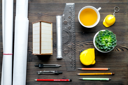 architect office with tools and cup in profession concept on wooden desk background top viewの写真素材