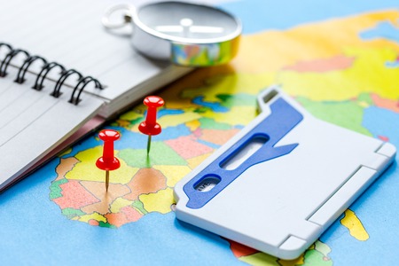 Booking travel concept with compass on map background