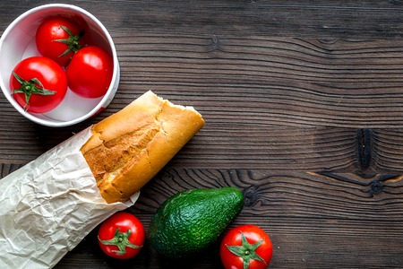 Healthy food, sandwich and vegetables in package on wooden table background top view mock upの写真素材