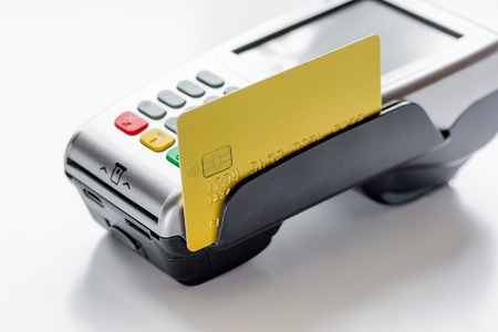 payment with credit card through terminal on white background