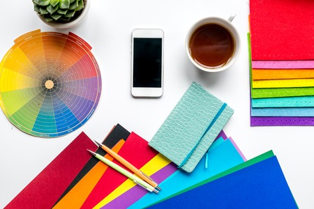 profession concept with graphic designer tools, cup of coffee and mobile on white work desk background top viewの写真素材