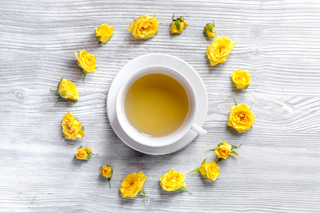 herbal tea with yellow flowersin spring design on light wooden table background top viewの写真素材
