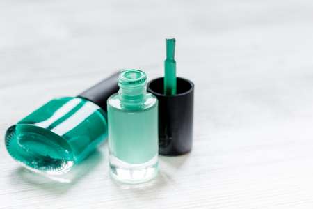 colorful set for nail polish in open bottles on white table background mock upの写真素材