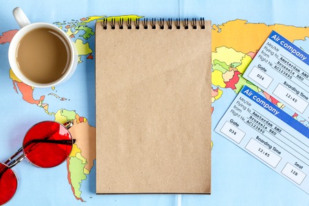 journey planning with tourist outfit on wooden table background top view mock-up