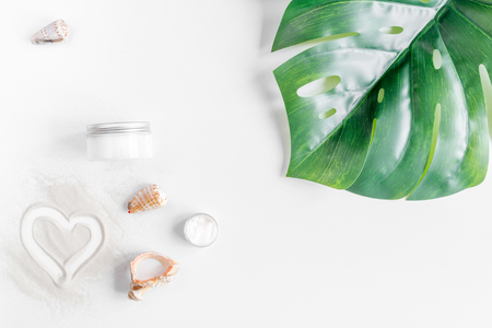 Cosmetic bottle with cream for sun protection on white background top viewの写真素材