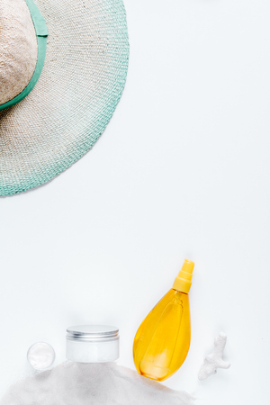 Woman cosmetic set sun protection lotion white background top view mock upの写真素材